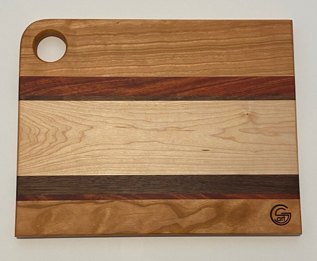 14in x 11in mahogany, walnut, maple and oak cutting board