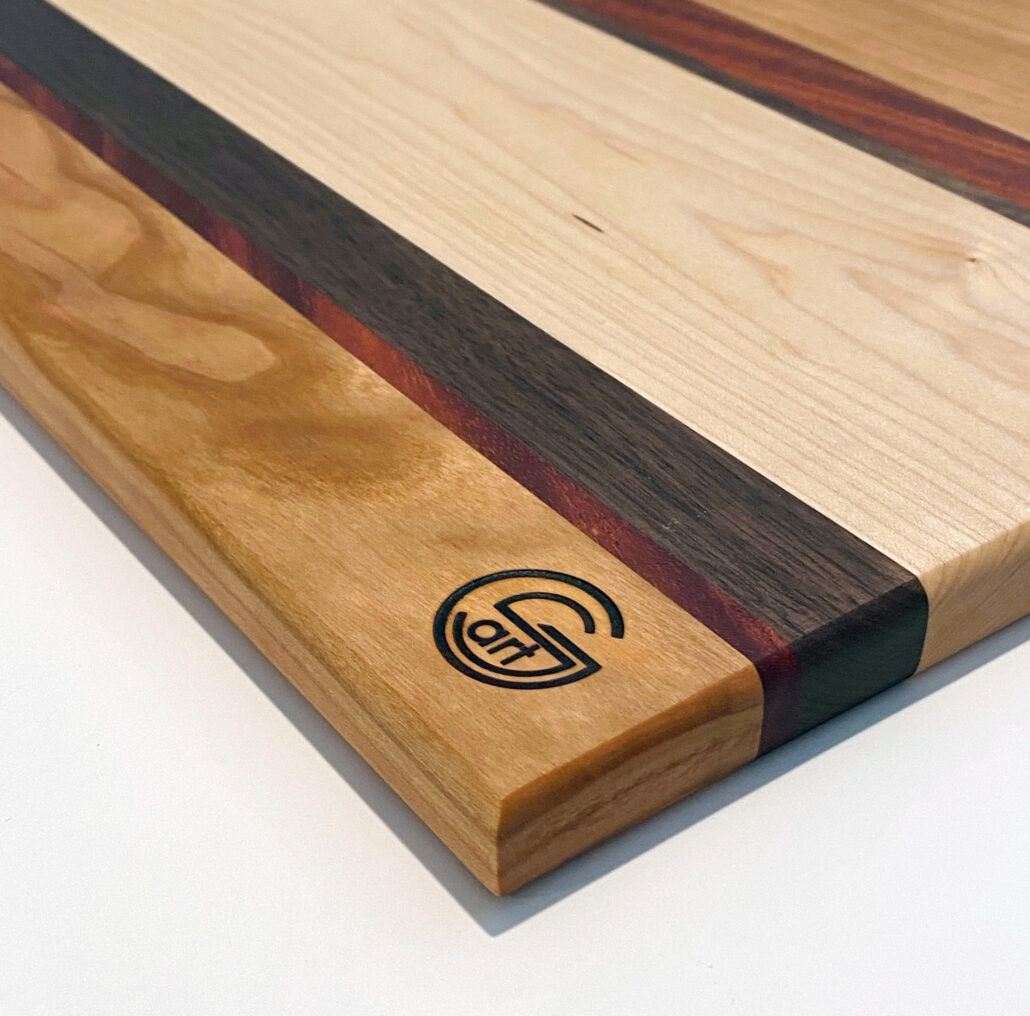 14in x 11in mahogany, walnut, maple and oak cutting board