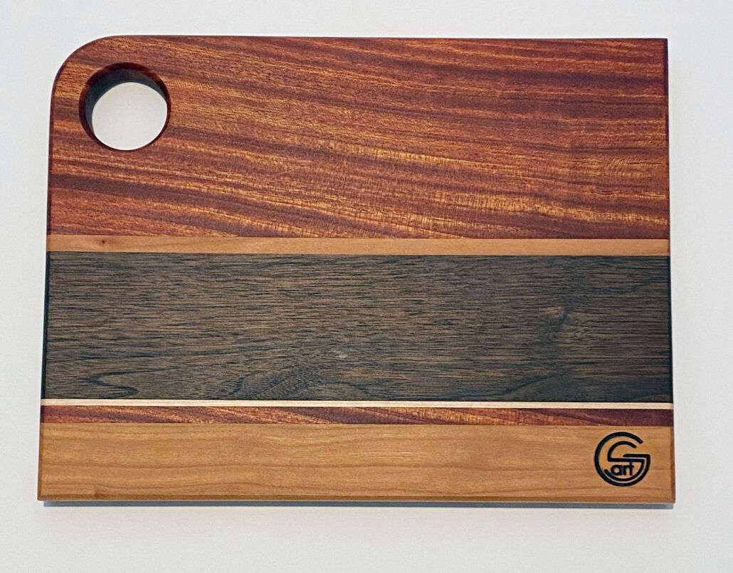 9in x 12in mahogany, walnut, maple and oak cutting board