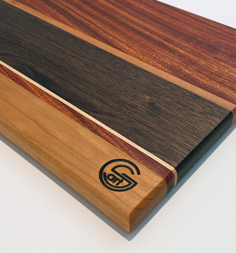 9in x 12in mahogany, walnut, maple and oak cutting board